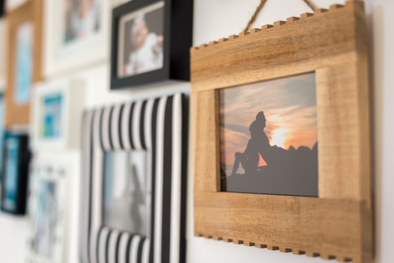 colorful frames of family photos on the wall