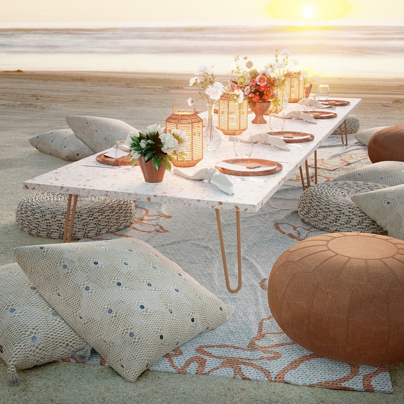 a scene of a picnic on the beach with a table
