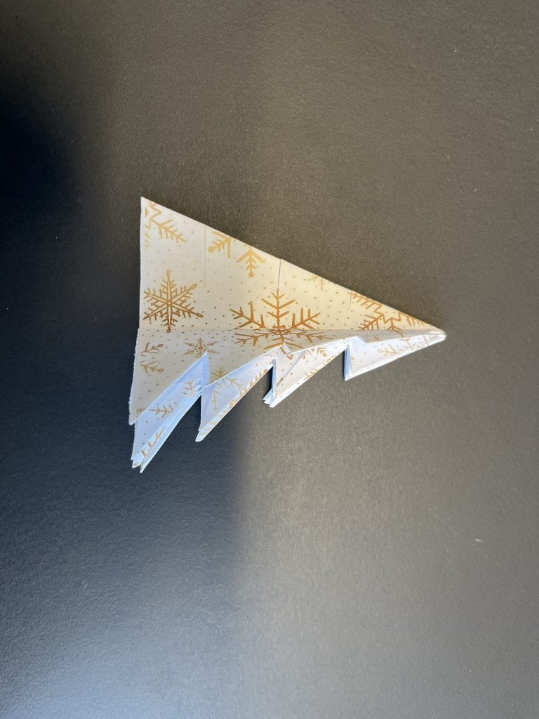 the preparation of an origami christmas tree 